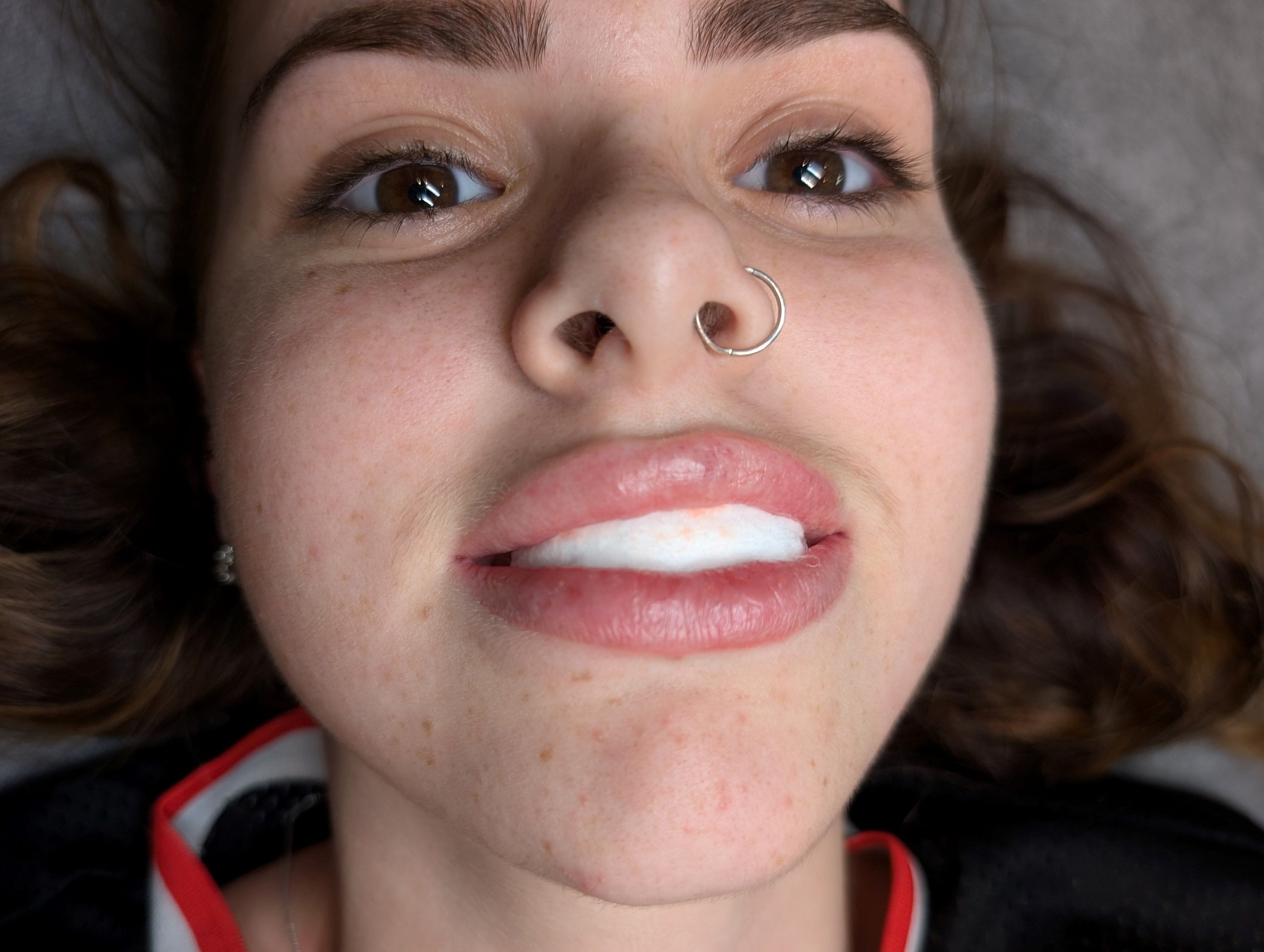 Close-up after shot of lips, showcasing the results of the cosmetic tattooing procedure.